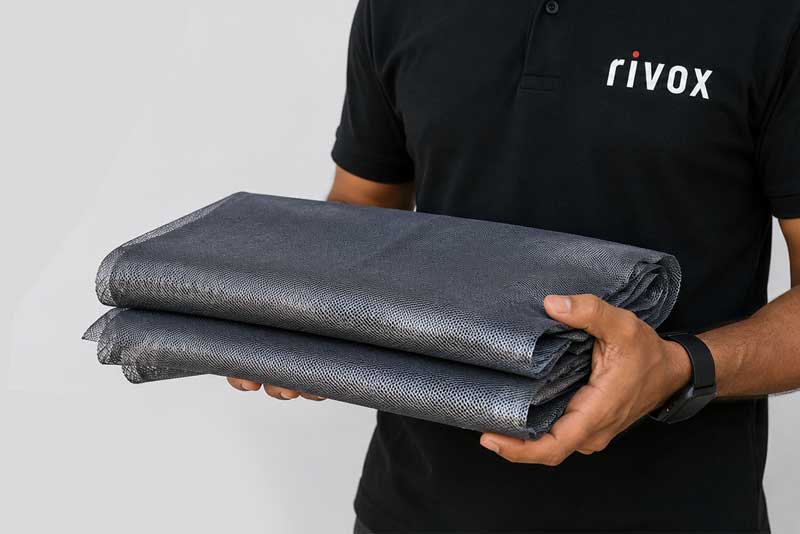 Foldable Holographic Mesh Screen material packed for compact shipping to international conferences